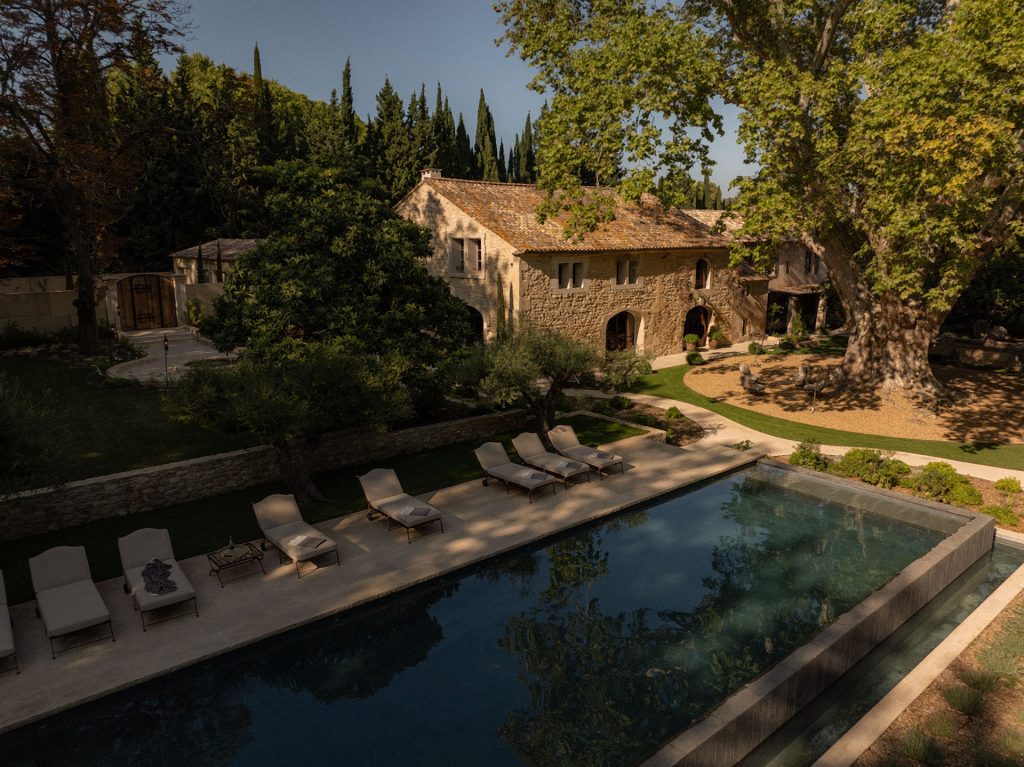Swimming pool at Le Mas de Castillone with sun loungers and scenic views