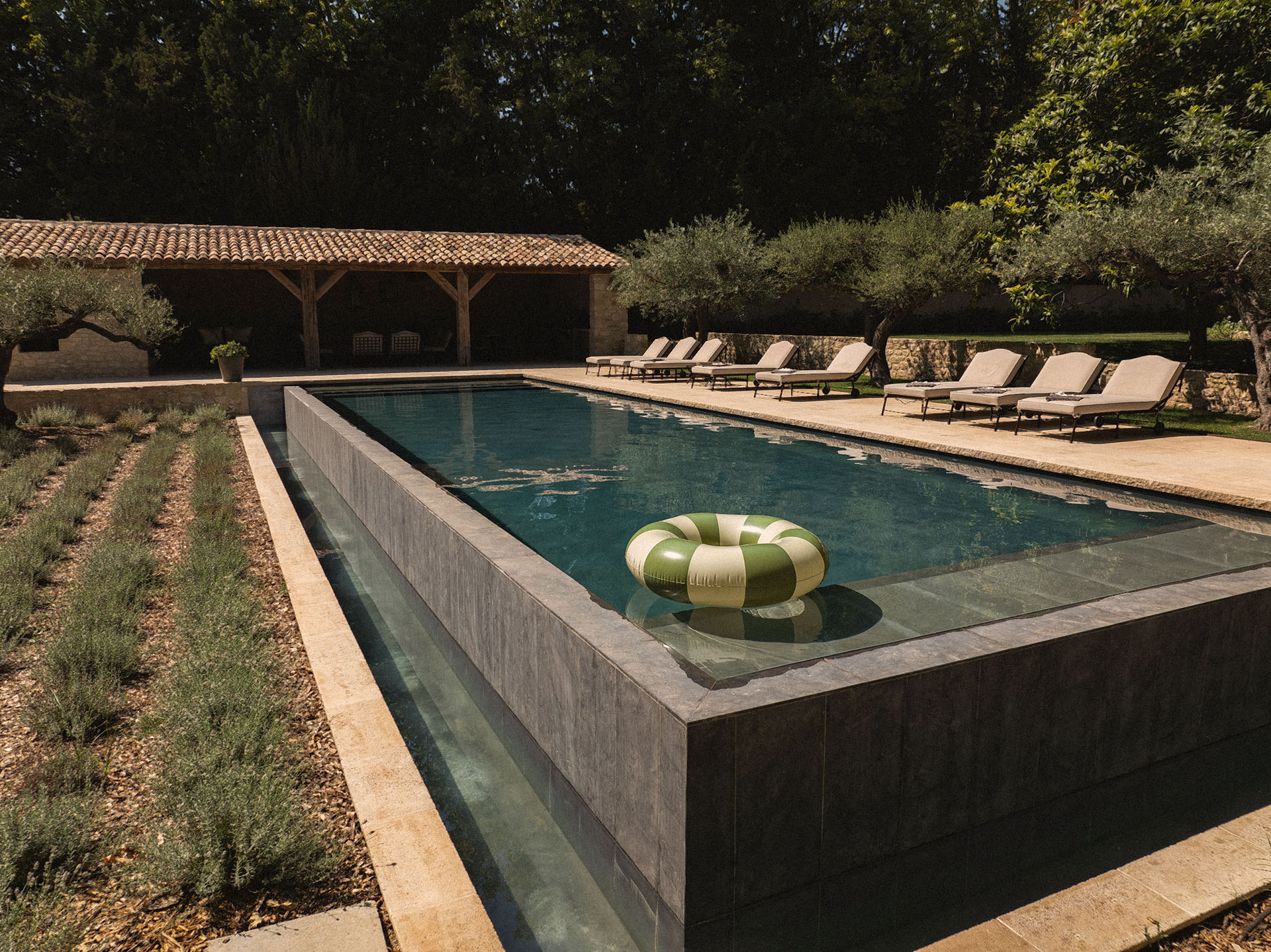 Luxury heated swimming pool at Le Mas de Castillone with scenic garden views