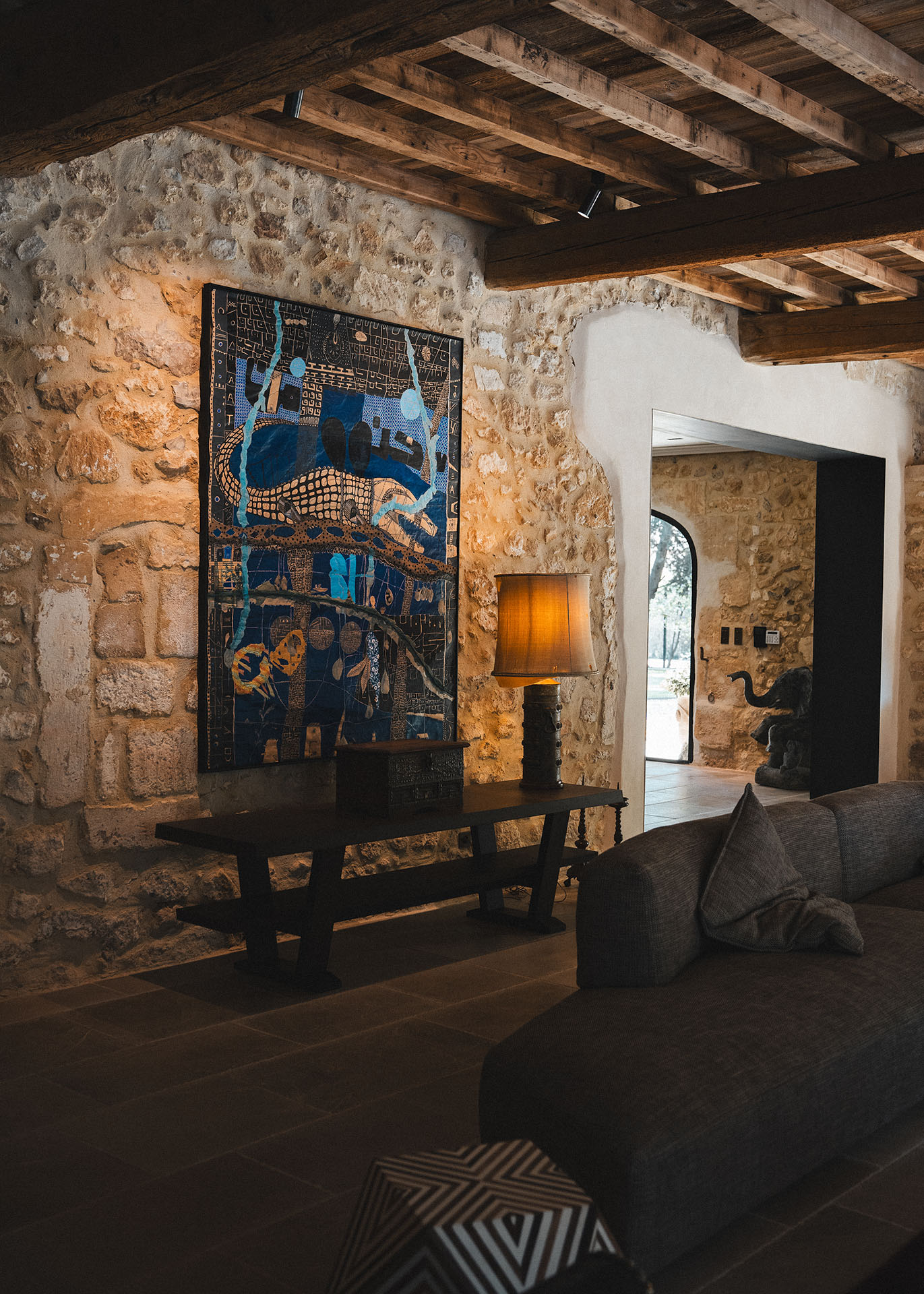 Luxury bedroom interior at Le Mas de Castillone with wooden beams and French decor