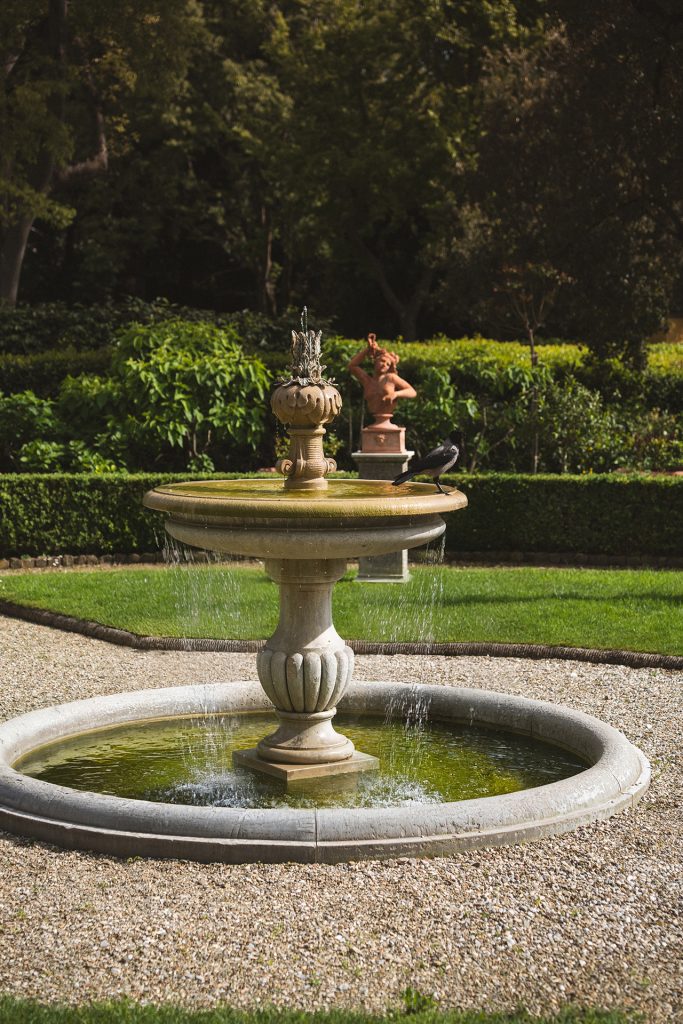 Historic fountain amid lush gardens at Four Seasons Firenze